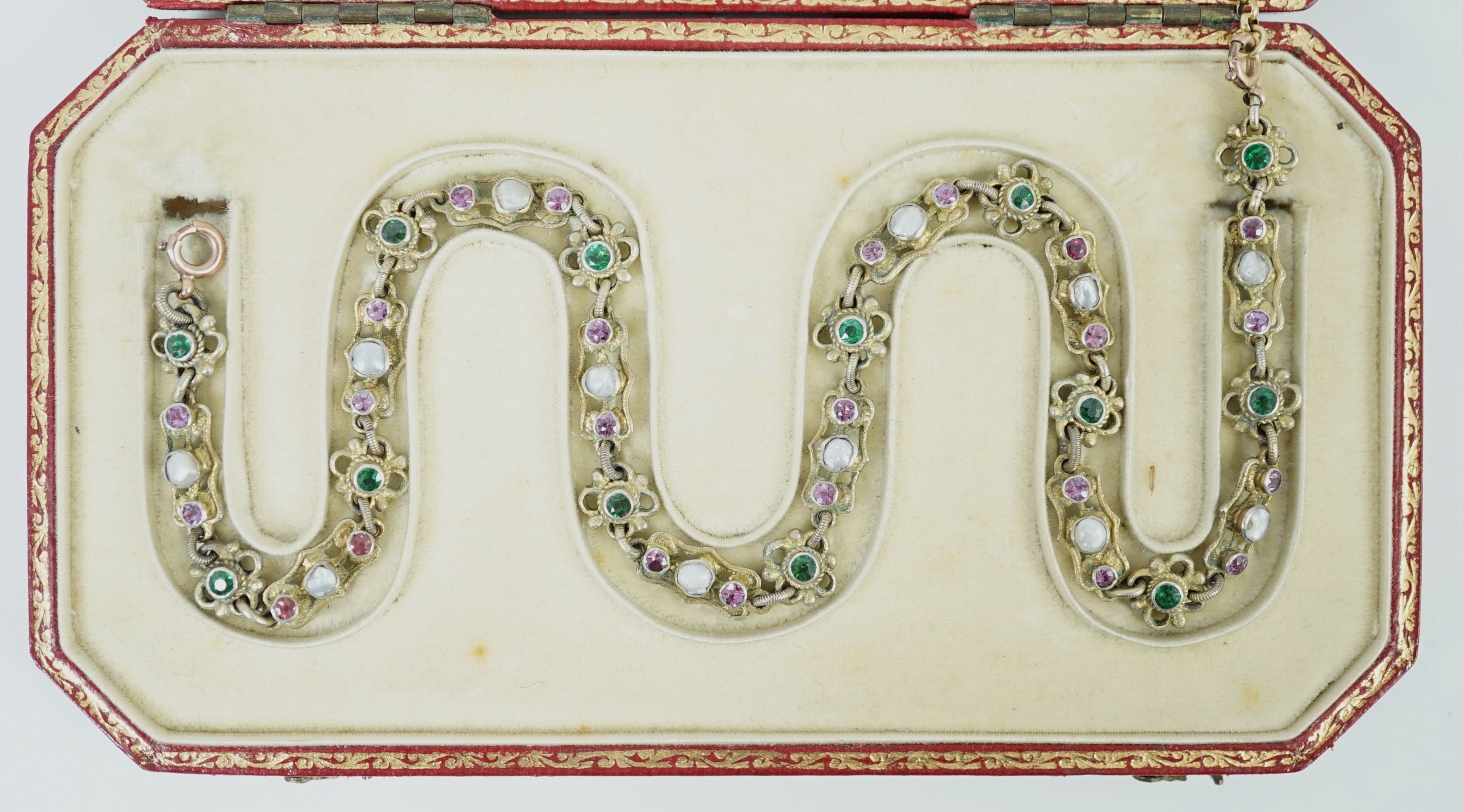 An early 20th century pierced and engraved silver gilt and gem set choker necklace, in the Suffragette colours